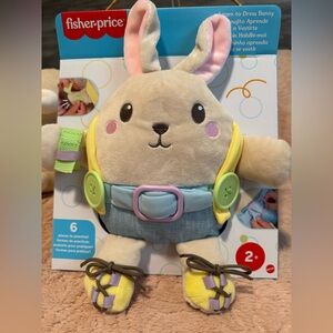 Fisher Price - Learn to Dress Bunny Plush Toy with Yellow and Blue Outfit.